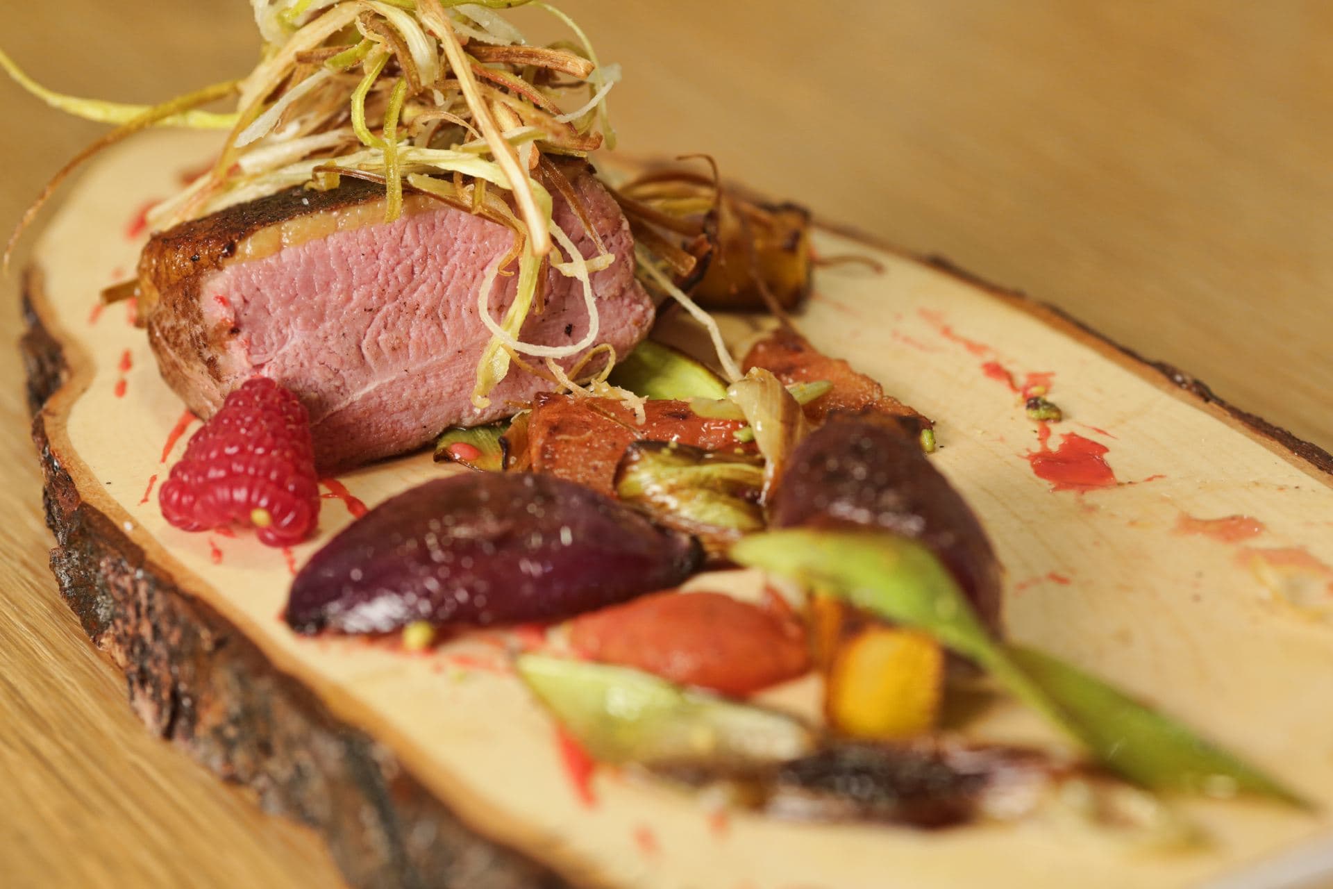Roasted duck breast, Caramelized onions, Raspberry mayonnaise and Crispy leeks