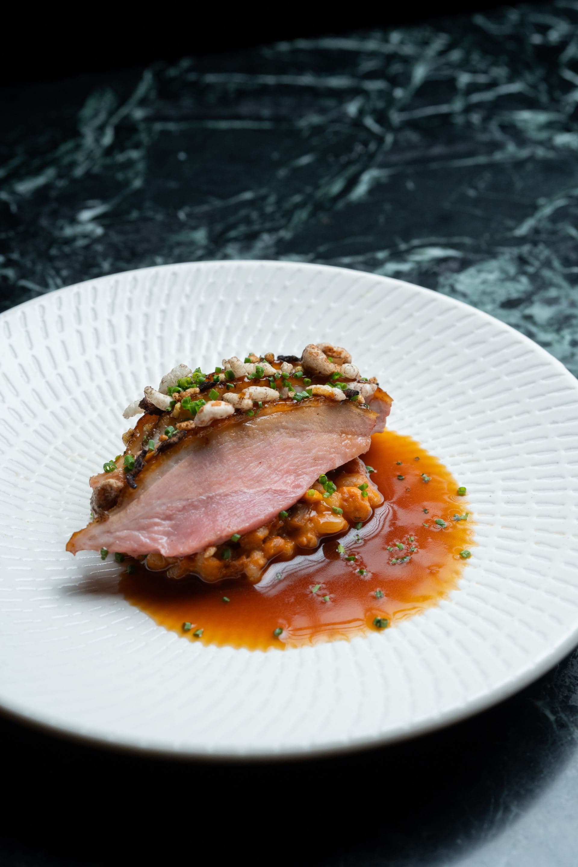 Aged duck breast, puffed grains, barley rice, miso duck jus