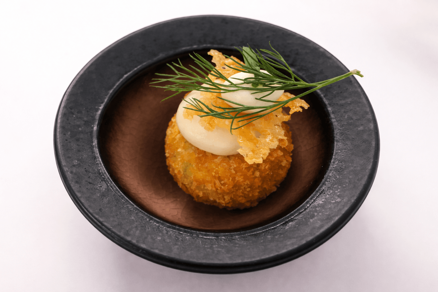 Fois gras arancini, truffled creme fraiche and parmesan crisp