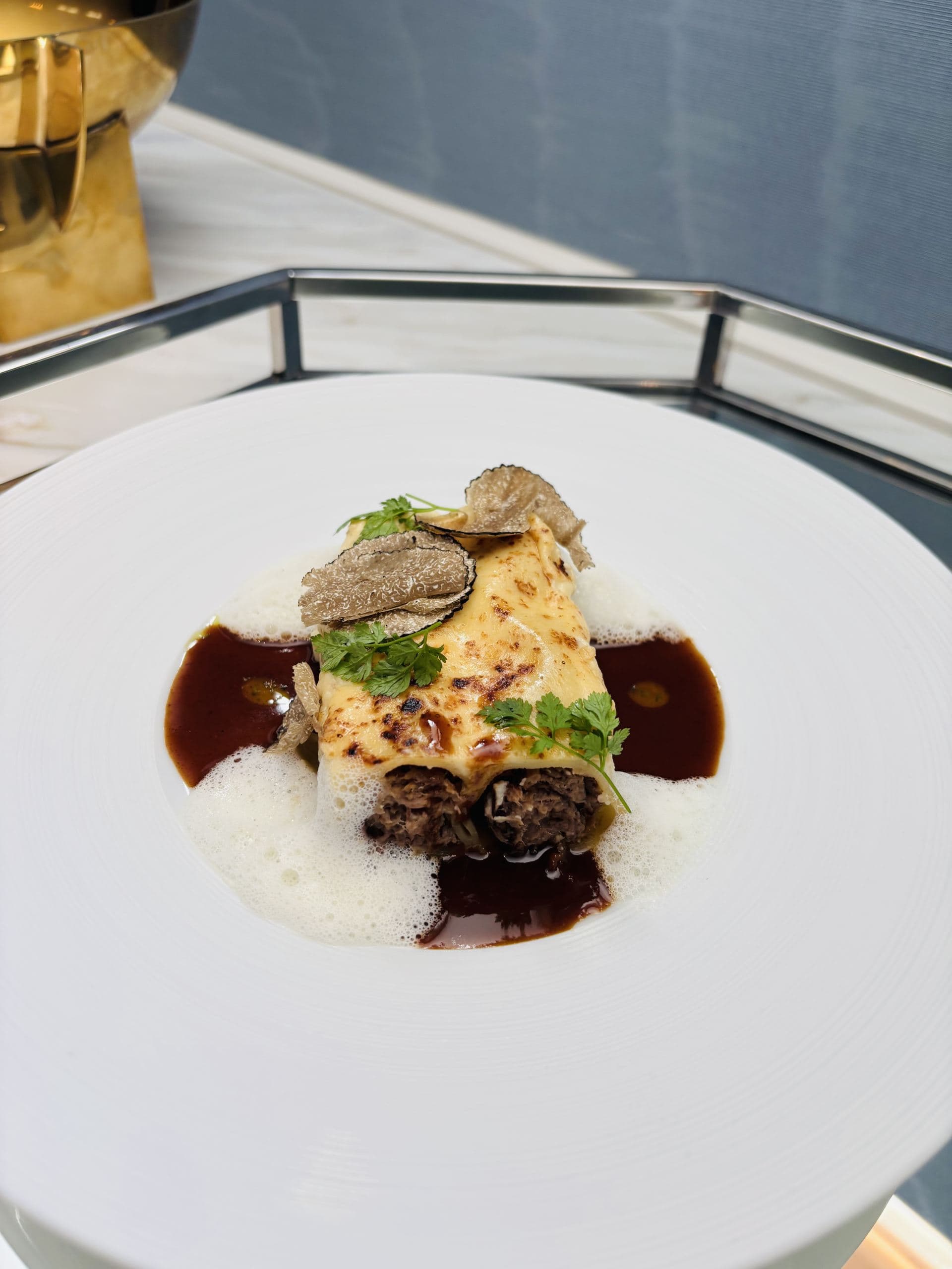 Cannelloni of short ribs with truffle jus and parmesan foam