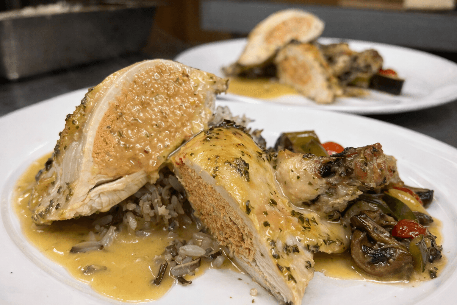Roasted chicken supreme stuffed with a farce of sun-dried tomato rosemary and feta